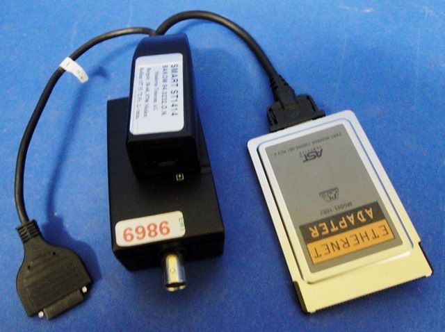 CARTE ETHERNET PCMCIA AST / 10BE 9869 en exposition chez Provendum à Lausanne (la photo contient un des exemplaires en stock) CARTE ETHERNET PCMCIA AST / 10BE (9869)